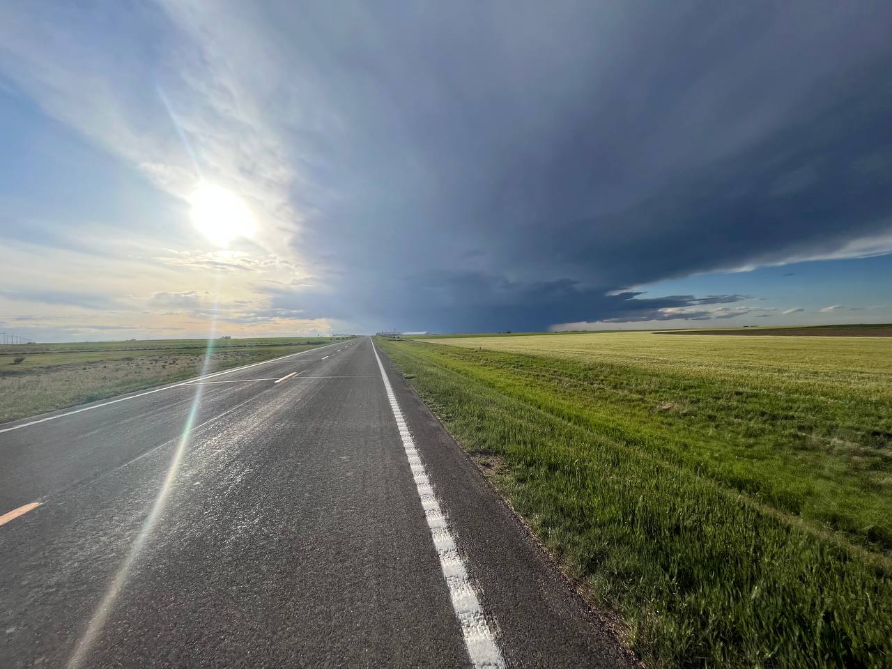 Endless roads and a thunderstorm in the distance